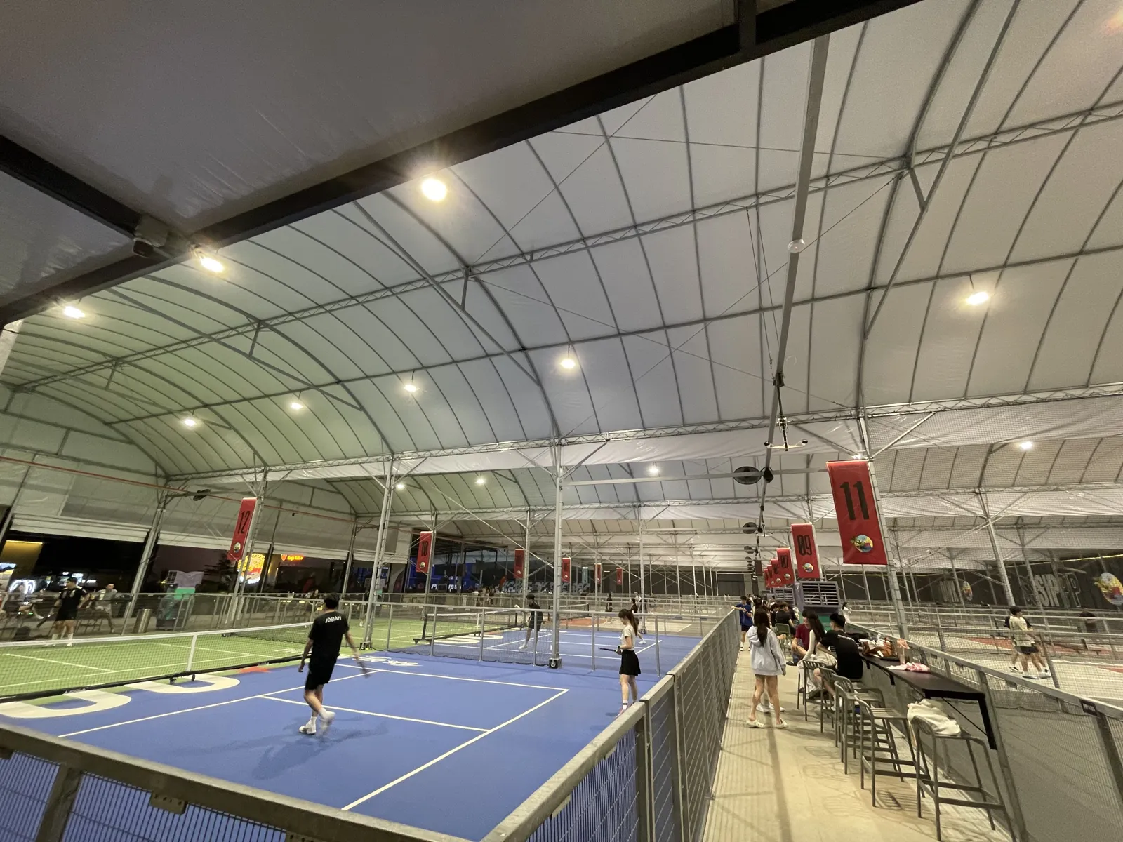 Evening games under the fabric roof at Pickle by the Sea on Gurney Drive